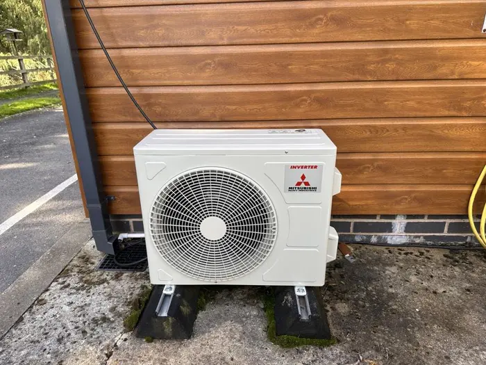 Mitsubishi Heavy Industries outdoor unit on mounting feet